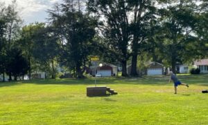 photo of man playing disc golf