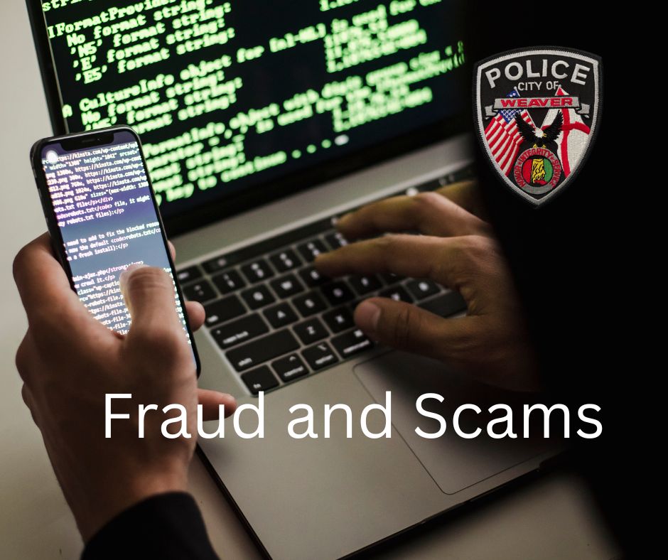 photo of man holding phone and entering information on a computer